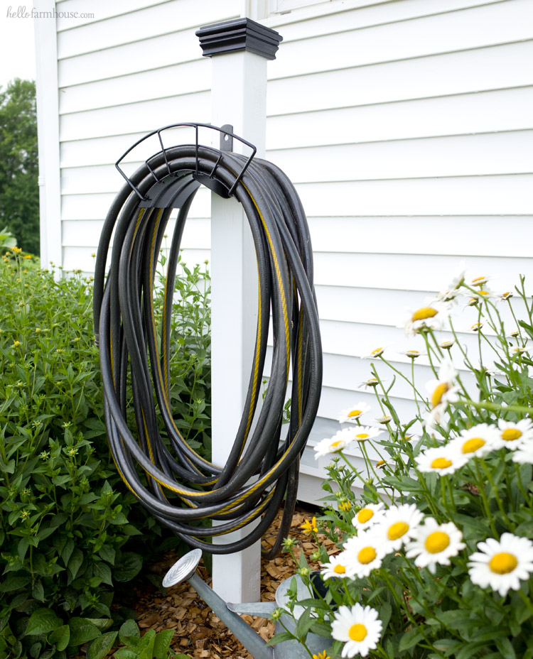 Keep your yard beautiful and organized with this super easy DIY hose stand project. It makes a huge difference and looks great in any landscaping!