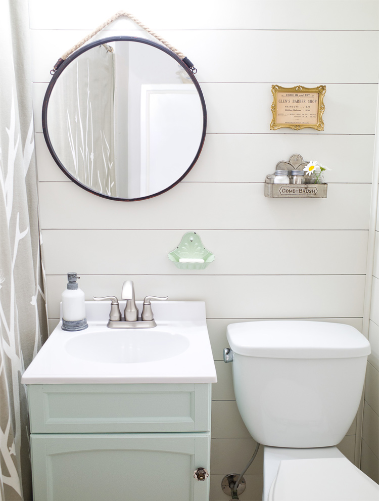 Transform your bathroom from dated to full of farmhouse charm in one weekend. Easy DIY farmhouse style bathroom makeover!