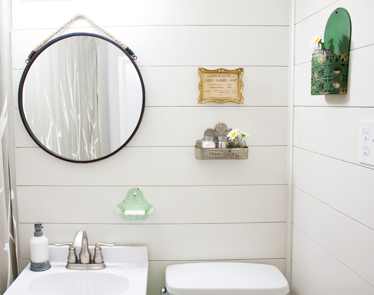 Transform your bathroom from dated to full of farmhouse charm in one weekend. Easy DIY farmhouse style bathroom makeover!